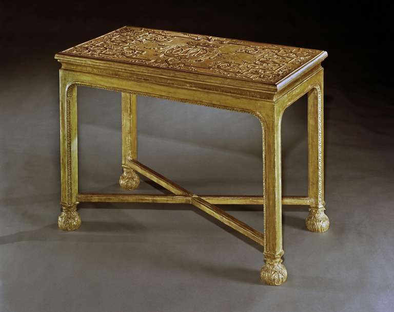 A very rare and important early 18th century carved gesso side table attributed to the royal cabinet-maker James Moore, having a rectangular top with finely carved gesso relief of scrolling strapwork and fine leaf carving, centred by a crowned