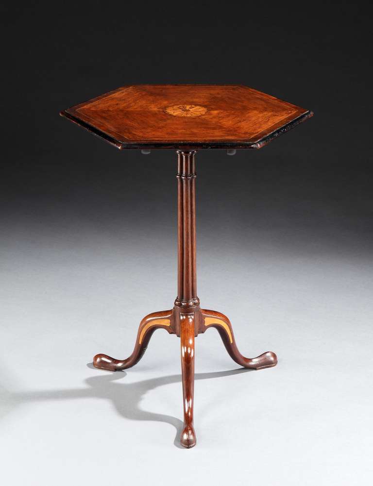 A fine mid 18th century Chippendale period satinwood inlaid mahogany tripod table in the manner of Thomas Chippendale, having a hexagonal top with moulded edge and central circular satinwood inlay, supported on a triple cluster column; on three