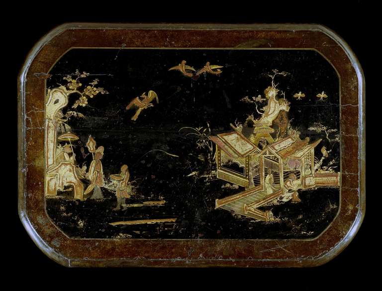 An extremely rare pair of George I side tables, the rectangular japanned tops with rounded corners and moulded edge with a border framing a raised scene of an exotic landscape with figures upon a bridge and beneath twinned birds in flight, the gilt