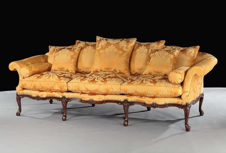 An exceptionally rare and important fine quality mid 18th century carved mahogany three seater settee attributed to the Yorkshire cabinet-makers Wright and Elwick, having a serpentine shaped back with outscrolled arms and squab cushion upholstered