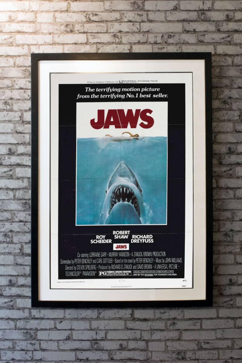 With the fish story to end all fish stories, Steven Spielberg was capitulated to the top rank of film makers in 1975 and Bruce the Shark became an instant cultural icon. This beautiful one sheet has the Classic image of this massive great-white