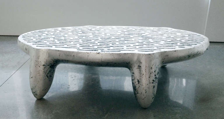 Wendell Castle [American, b. 1932]
Triad table, 2006
Fiberglass with silver leaf relief carving
17.5 x 64 x 36.5 inches
44.5 x 162.6 x 92.7 cm
Edition of 8

Born in Kansas in 1932, Wendell Castle received a B.F.A. from the University of