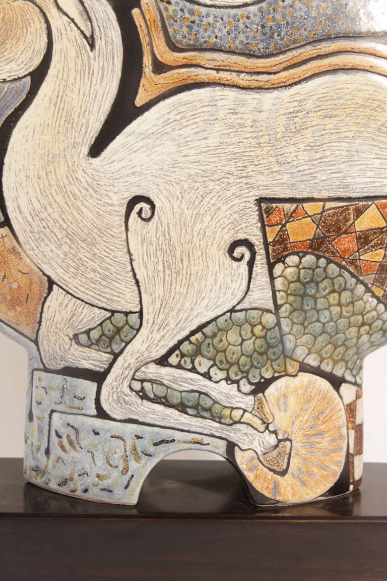 Original polychromed glazed ceramic  from Spanish Artist Manuel Millet.
The surreal images represent a scene with  mythological animals on a beige background