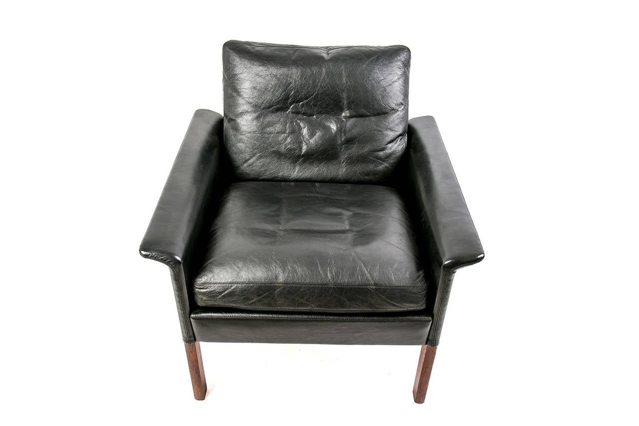 Original well preserved Hans Olsen black leather armchair. Edition: C/S Mobler 1.950. Hans Olsen (1919–1992) was a Danish furniture designer who created a number of items in his own distinctive style. he belongs to a group of Danish furniture