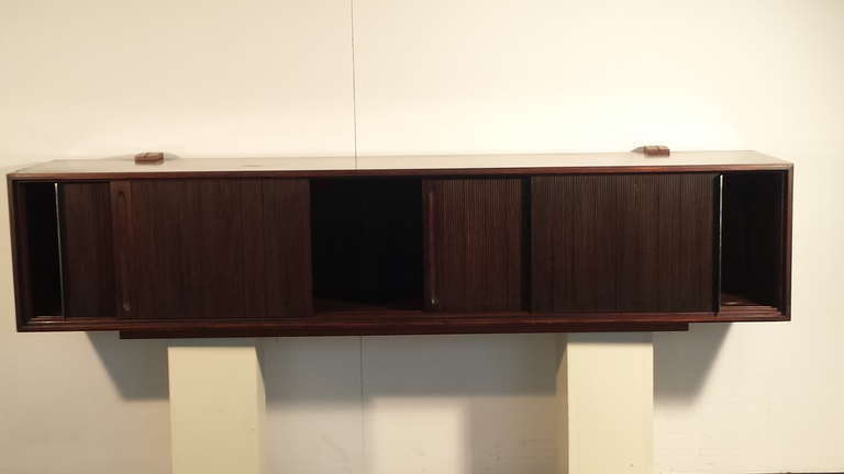 wall hung cabinet in rosewood with 4 sliding doors by Rima Padova, custom made for a beautiful villa in Vicenza