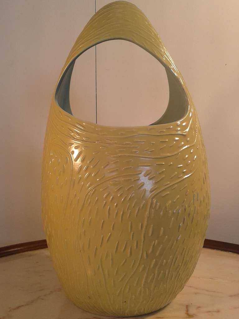 casting glazed earthenware modeled in yellow and blue , umbrella stand C300 signed on the base SocietÃ  Ceramica Laveno 
1954