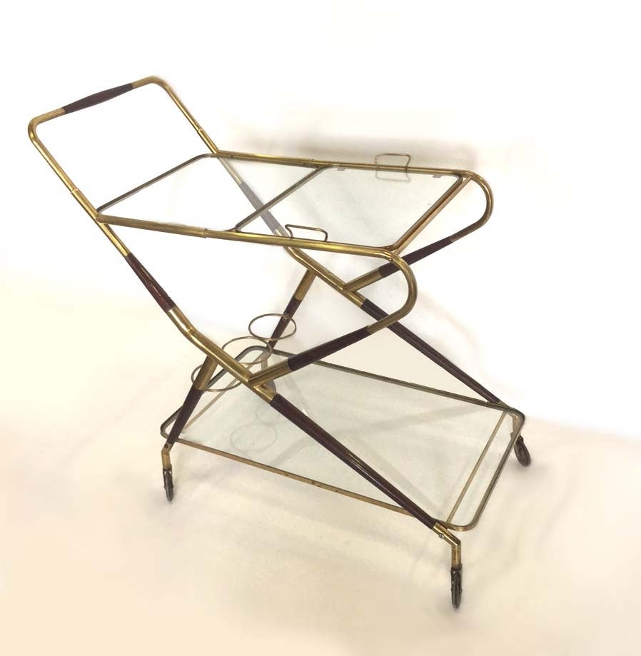 Very nice cart with two levels , the low one glass shelve is for bottles , the upper are two removable with brass handle 
Designed by Cesare Lacca in 1950 , this wood and brass bar cart is very convenient and relevant today
