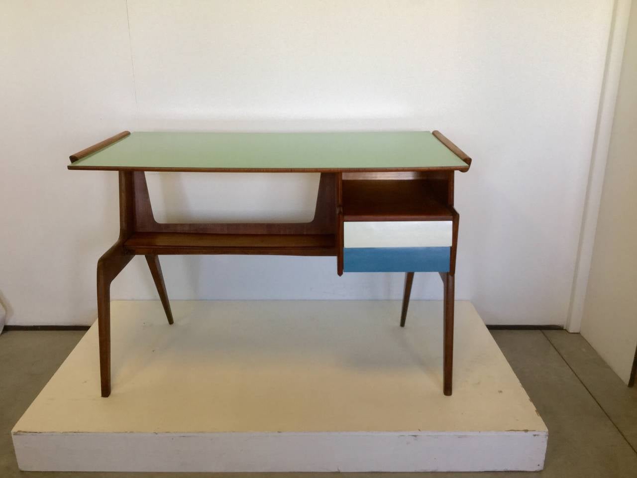Beautiful desk with top and drawers in colored formica and walnut wood , this model is normally attributed to GIO PONTI and GIordano Chiesa manufacturer , the shape is very closed to PONTI style and also the colors belong to its own repertory