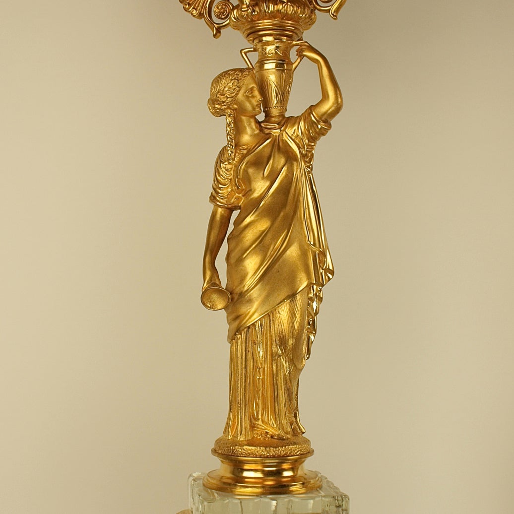 A pair of early 19th century exquisetly executed ormolu five-light candelabrum, attributed to L’Escalier De crystal. The luxury store of the Maison a L'Escalier de crystal was stablished in 1802 by Mme. Désarnaud, it supplied clocks, lamps and other