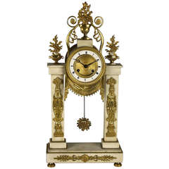 A French Empire Ormoulu and White Marble Mantel Clock