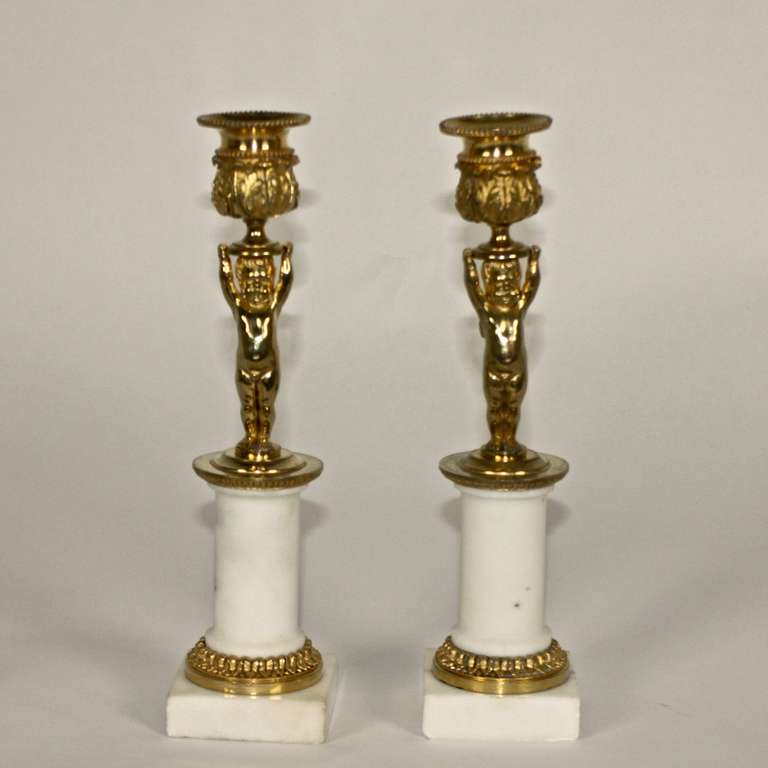 Pair of Empire "Cupid" Candlesticks