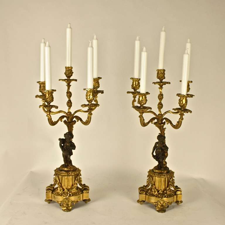 Pair of 19th Century Gilt Bronze Candelabra with Winged Cupids