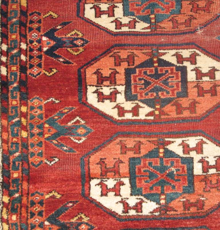 This large eastern Turkmen tent carpet with square proportions uses the quartered animal gul known as the ‘tauk nuska’ named for the double headed birds in each compartment. Though thicker than most, this piece may have been the work of the Kizyl