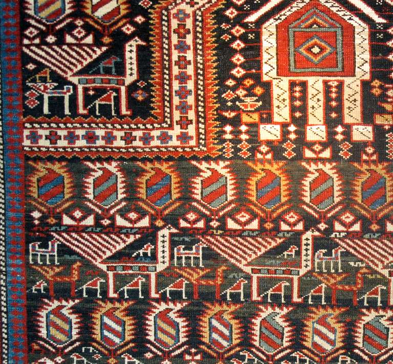 This charming Shirvan prayer rug draws alternating rows of ‘boteh’ (paisleys) with a variety of animals derived from traditional South Caucasian weaving. Large peacocks march in procession along with smaller birds and quadrupeds. A distinct