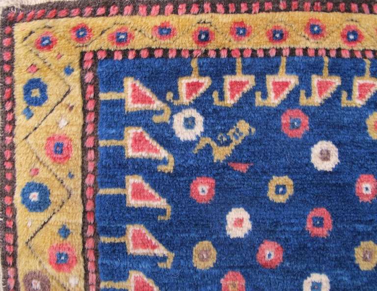 A ‘mafrash’ in the Persian and Caucasian weaving traditions is a long and narrow cargo bag composed of four side panels, a fixed bottom and a top flap. This friendly elongated South Caucasian pile piece was most probably woven as a mafrash side