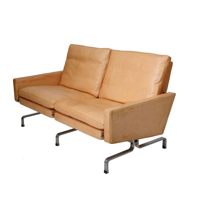 The PK 31/2 sofa designed by Poul Kjærholm in 1958. Made by E. Kold Christensen, Denmark. The sofa has been re-upholstered with natural leather which will gain a beautiful golden-brown patina with use.