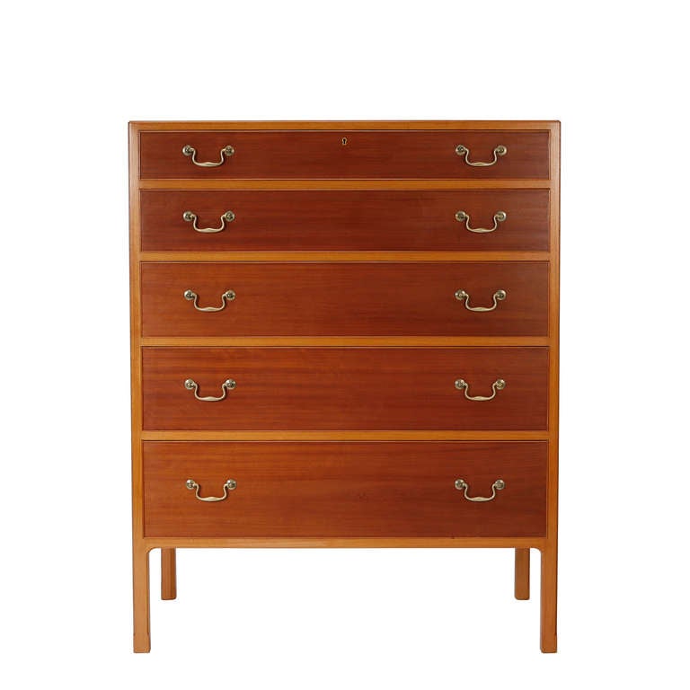 A chest of drawers in mahogany. Five drawers with handles in brass. Designed and made by cabinetmaker Jacob Kjær
