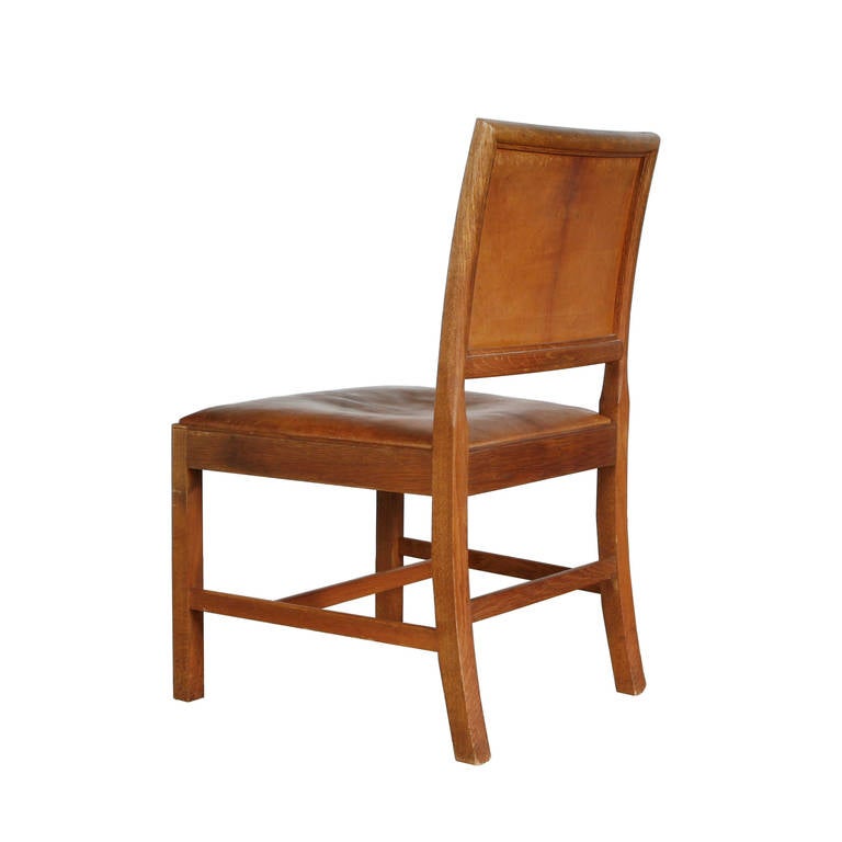 A rare chair in oak with original Niger leather. Designed by Danish architect Kaare Klint in 1927. Made by Rud. Rasmussen, Copenhagen