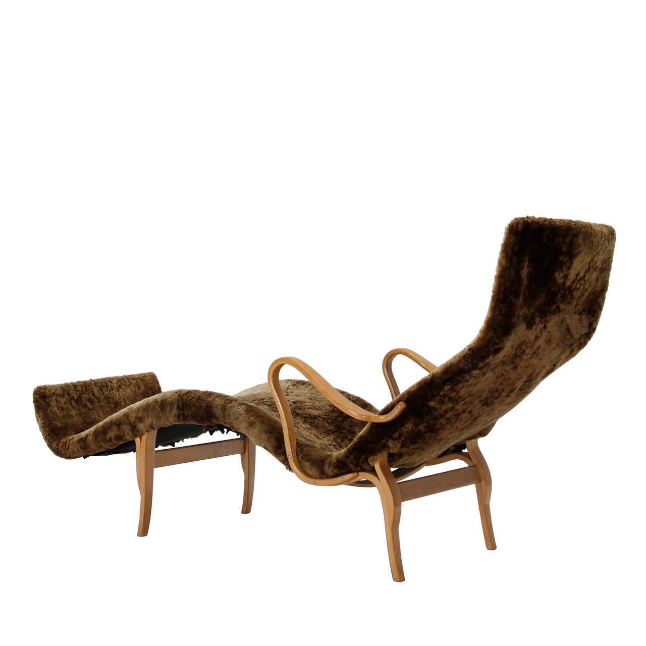A super comfortable and beautifully made lounge chair with a sheepskin cover. Designed by Bruno Mathsson in 1944. Made by Karl Mathsson, Sweden. Signed 