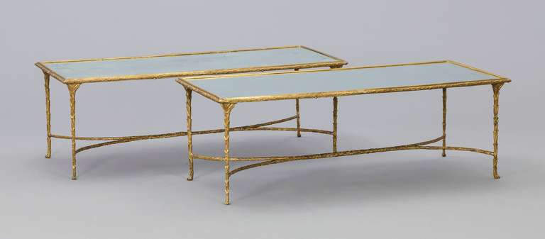 Very rare pair of coffee / cocktail  tables, Maison Bagues, resting on a base with gilt bronze with laurel leaf relief, 
mirrored tabletops, 
ca. 1960. 

Shipping to N.Y.C Seaport or Los Angeles Seaport $ 595.-

44 x 132x 56 cm
17x 52x 22 inch