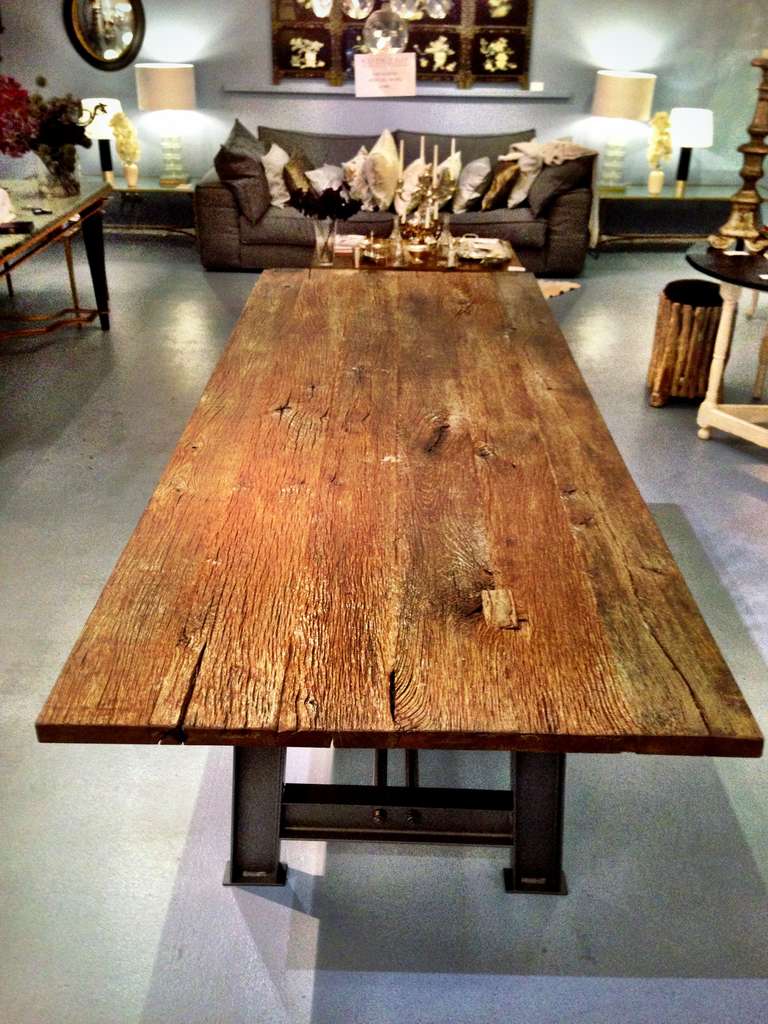 A industrial Design Table with a antique oak tabletop.
The iron table base is custom made but not old.

Shipping to N.Y.C Seaport or Los Angeles Seaport $ 595.-