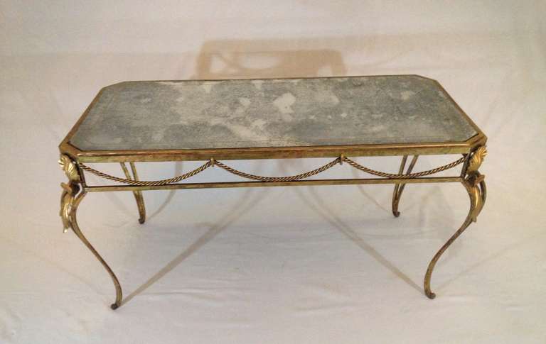 A french Art Deco coffee table with mirrored glass top.
France, around 1930.
100cm x 50cm x 50cm