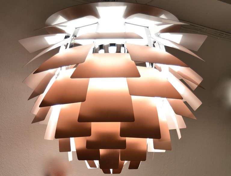 Poul Henningsen Artichocke copper 84 cm (largest size)

Designed for the Langelinie Pavilion in Copenhagen in 1958.

It has been in production eversince by Louis Poulsen

The Artichoke gives a beautiful and warm glarefree light.

This lamp
