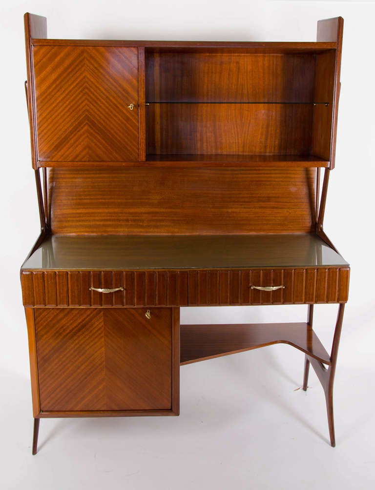 1950s Italian mahogany desk cabinet with glass shelf and two drawers on a designed beech curved side supports in the style of Ico Parisi.
