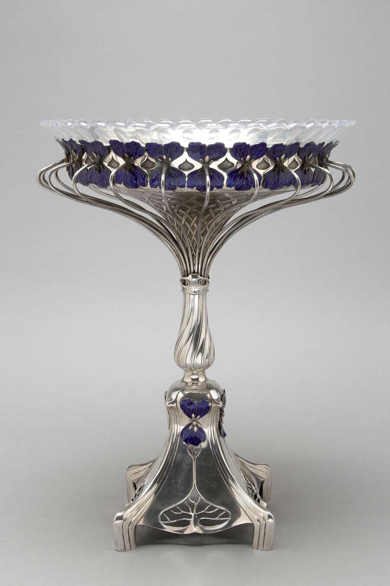A unique and rare table centerpiece.  Sterling silver and Enamel with original glass dish.  Austrian circa 1880.  Fully hallmarked in Vienna.  The enamel in perfect condition.

Ht 22 inches
Wt 65 ounces