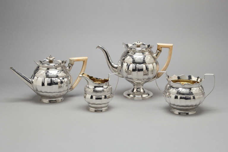 Sterling silver antique Georgian tea & coffee service.  Very unusual facetted design with each piece finely engraved with 