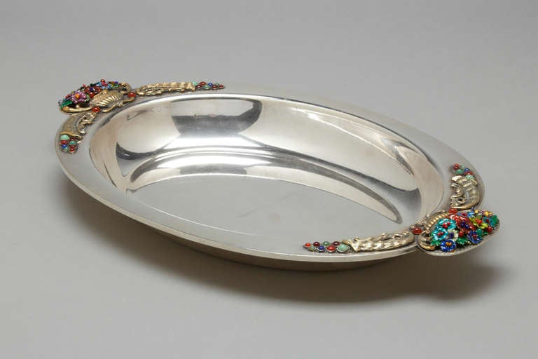 A rare and unusual sterling silver and enamel tray.  Italian, circa 1970.  It is fully signed by the artist on the back of the tray and hallmarked.

L 12 inches
Wt 30 ounces