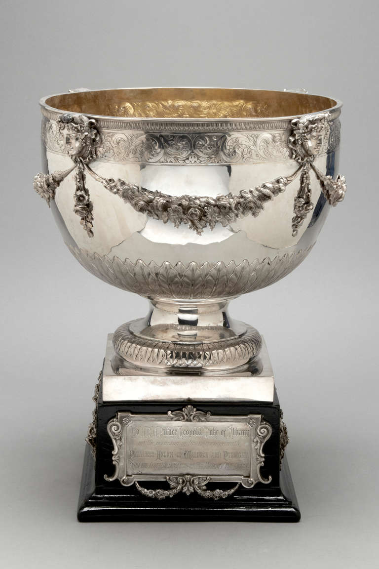 A unique antique sterling silver Royal Bowl.  English, London 1883.  Maker JE Terry.  The plaque on the base bears the contemporary inscription and the Royal initials on the reverse of the plinth.  A finely chased and engraved bowl of Royal