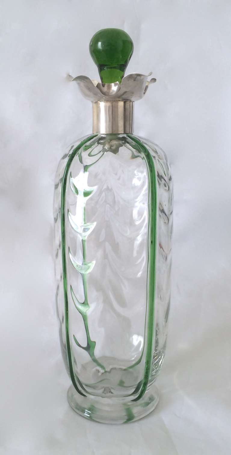 A rare and unusual Glass and sterling mounted Decanter
Hallmarked in England 
1900
The body with a green glass 