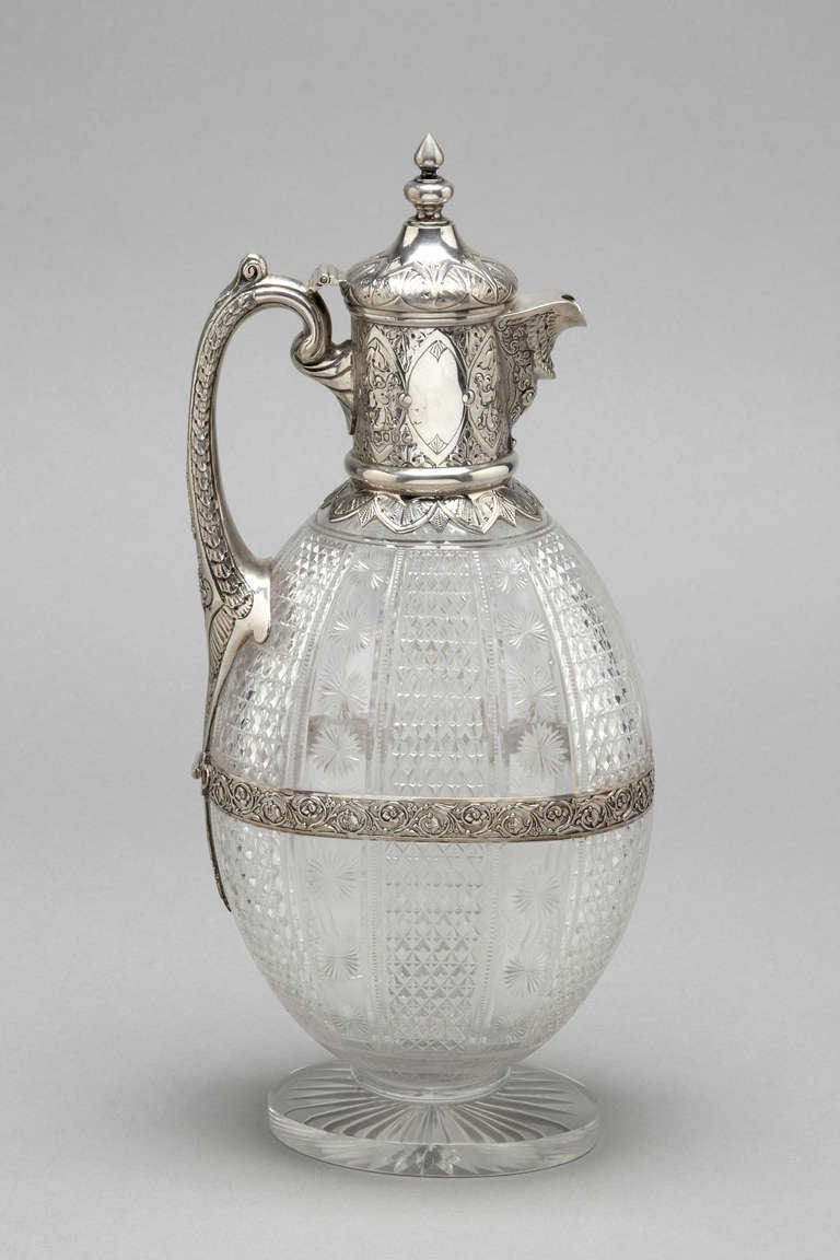 Sterling silver and cut glass Claret Jug
London 1888
Charles Eddington
A finely chased silver mount, fully hallmarked 
The original glass with hand cut flowers and 