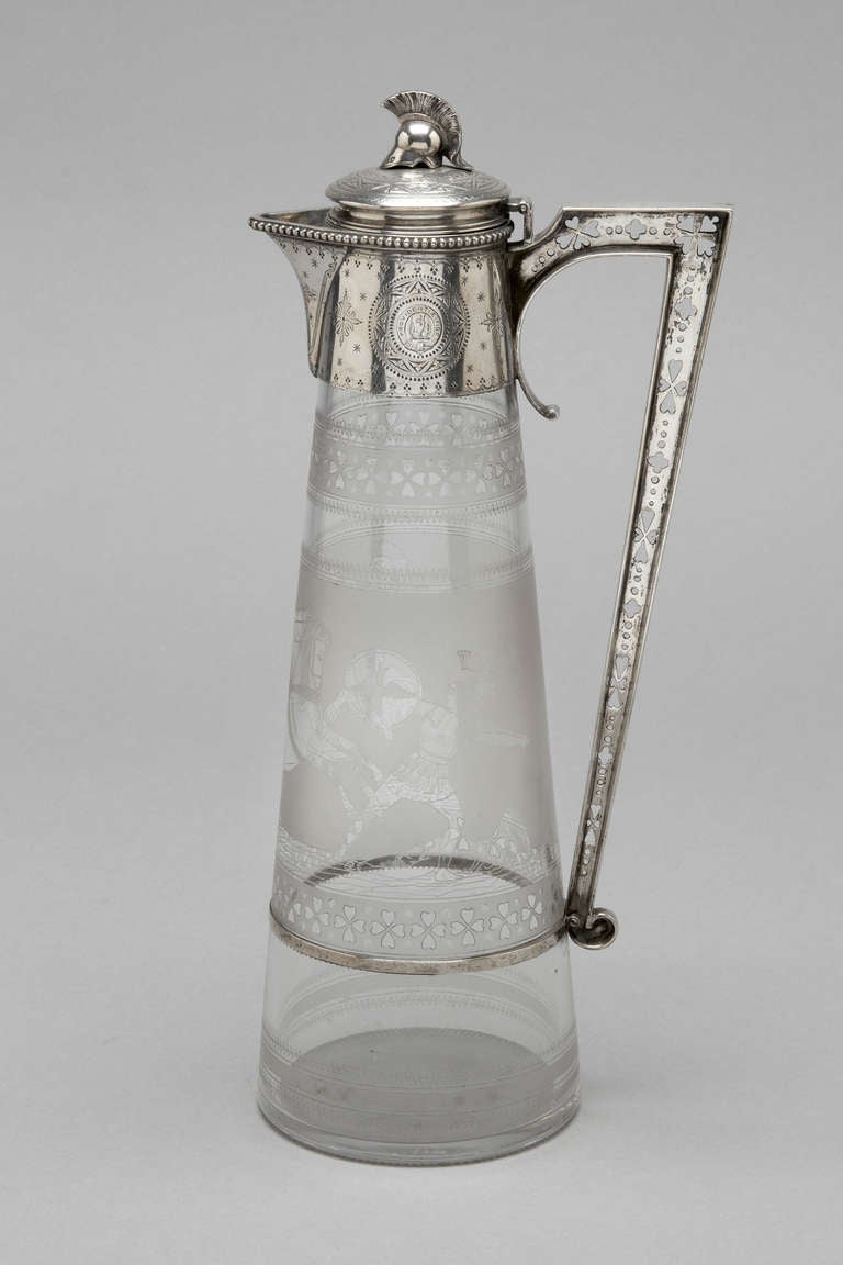 Sterling silver mounted Claret Jug with rare mount and engraved original glass.
Elikington & Co
London 1872
The mount is engraved and the finial cast as a warriors helmet.
The glass finely engraved with 