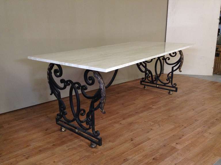 Large 1940's dining table in wrought iron with travertine top.