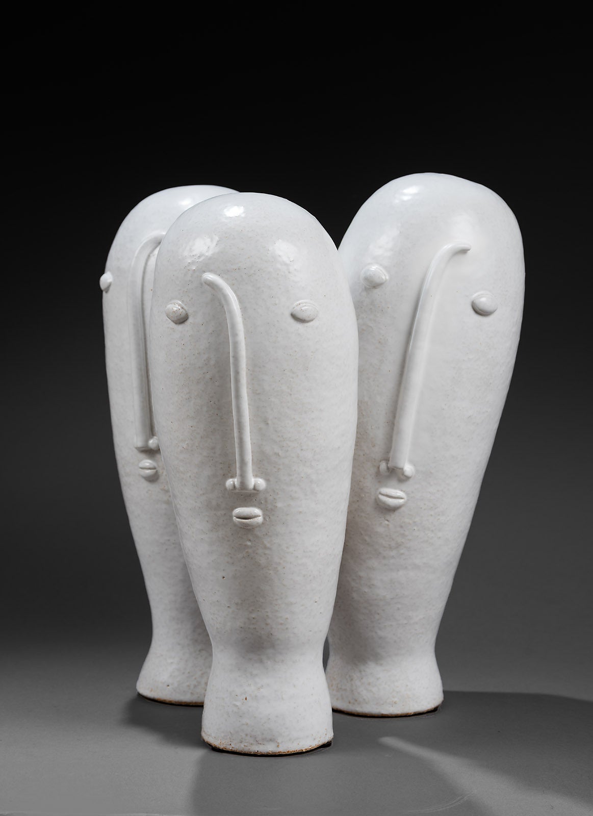 A biomorphic sculpture called  "Perce-neige" referring the little flower form : stoneware glazed in deep milky white, forming 
3 stylized figures. 2015.

All the pieces signed by the DaLo, hand modeled, are unique.

Other DaLo pieces,