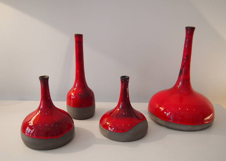 A set of four red enameled grey stoneware signed by Dalo.

Daniel and Loic (Dalo) are designing together since 2007 original ceramic pieces. Inspired by the second part of the 20th century French ceramists, they created their own style, a poetical