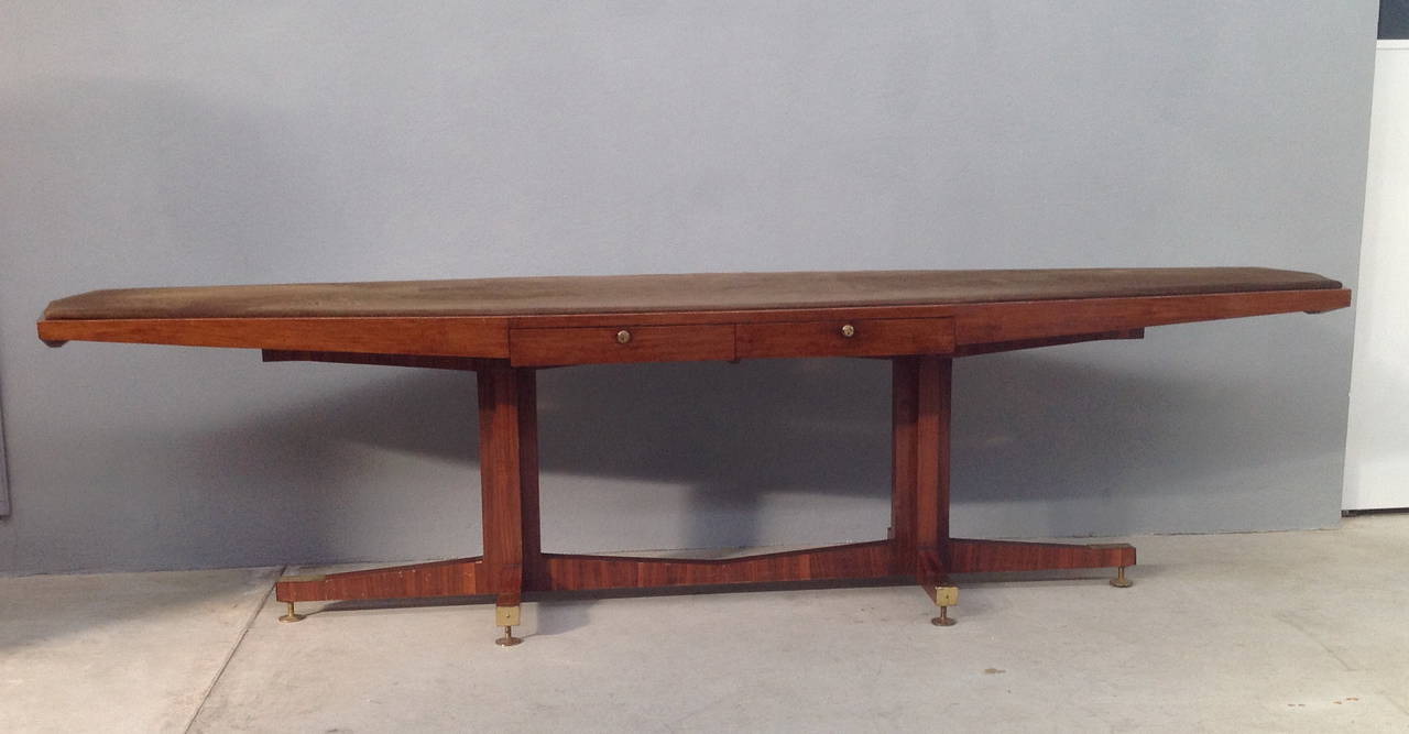 Walnut table with Velvet top legs with brass details designed for a famous jewelery in Milan.