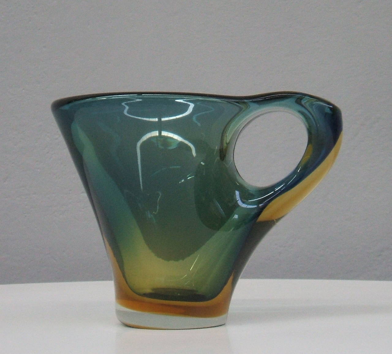 Handblown green and yellow glass pitcher.