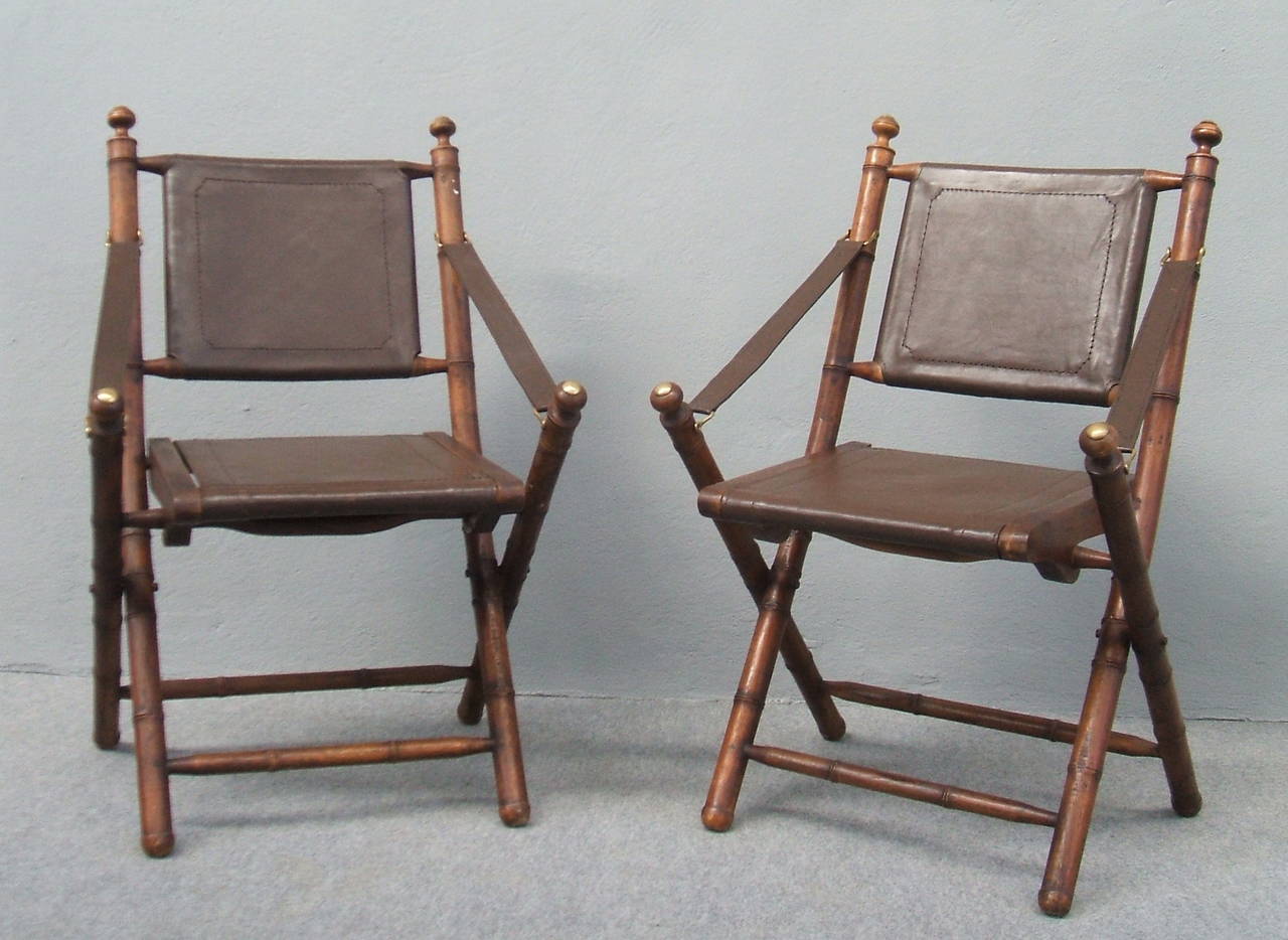 Faux bamboo and leather hunting folding chairs.