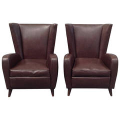 Elegant pair of leather armchairs in the style of Paolo Buffa