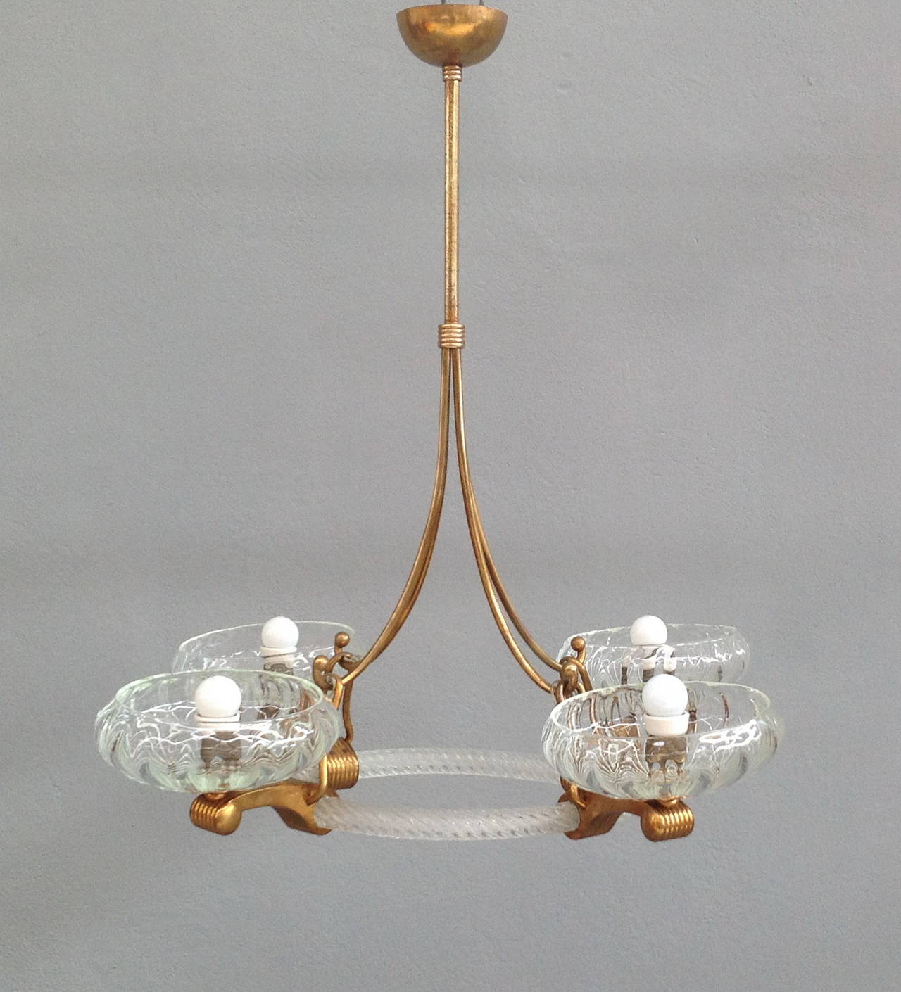 Elegant 4 lights Barovier chandelier with brass and glass structure and 4 brass arms holding hand blown glasses