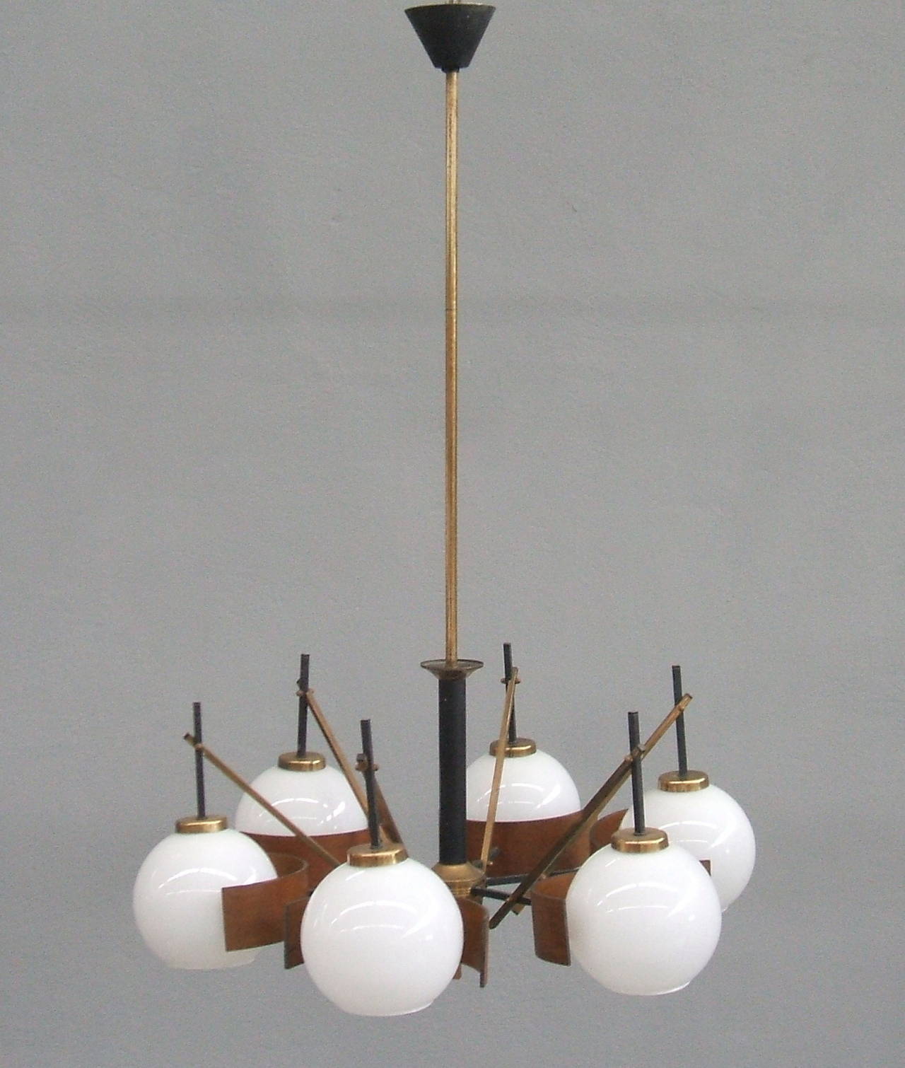 Six lights Italian chandelier with opaline glass, brass, wood and lacquered metal.