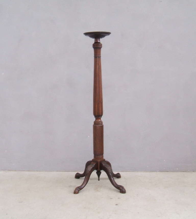 Mahogany carved pedestal.
The pedestal base supported by 4 splayed legs with paw feet.