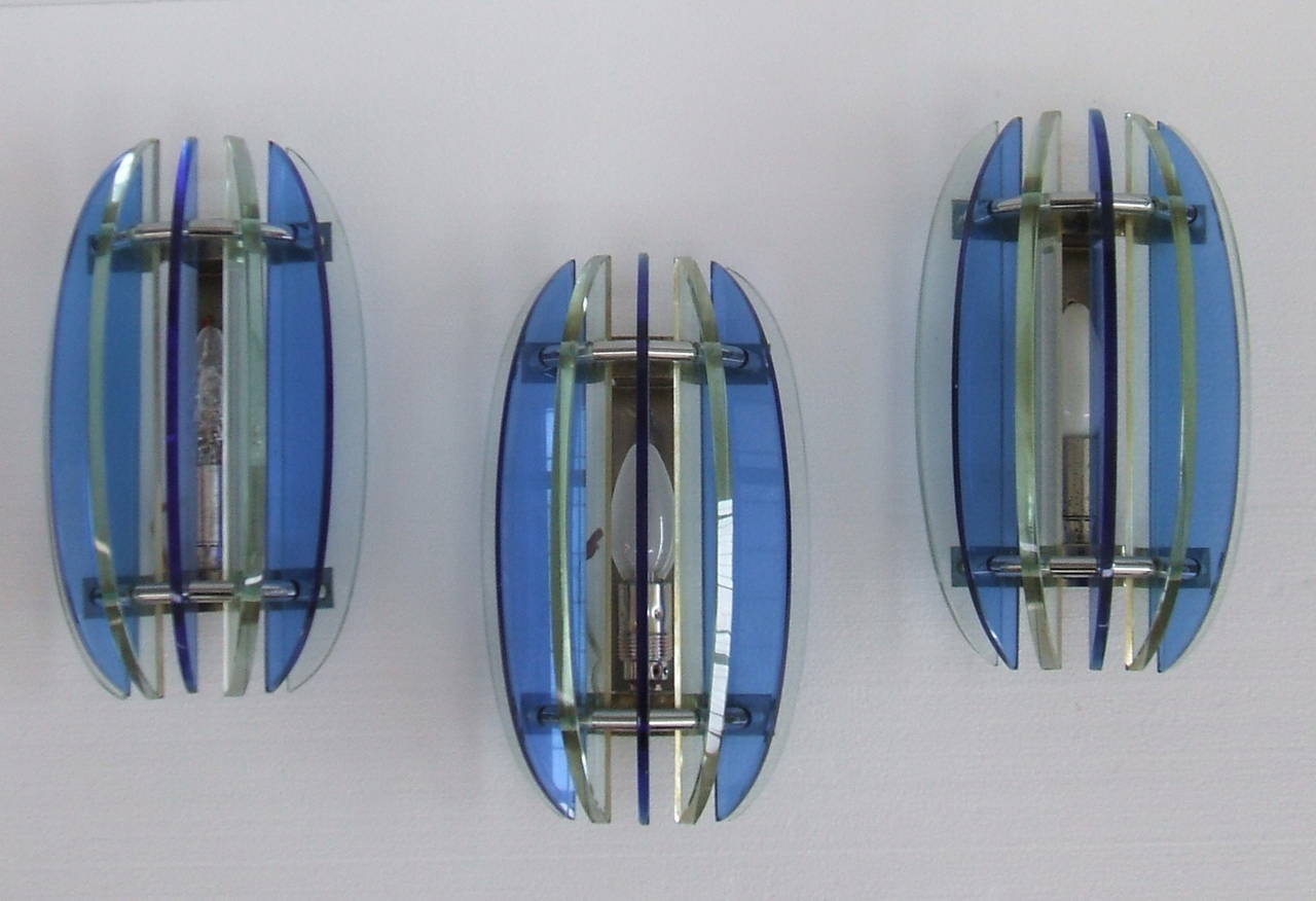 Blue and clear light wall sconces stamped Veca