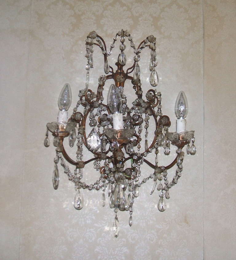 A pair of crystal wall sconces matching to the chandelier posted on my storefront.