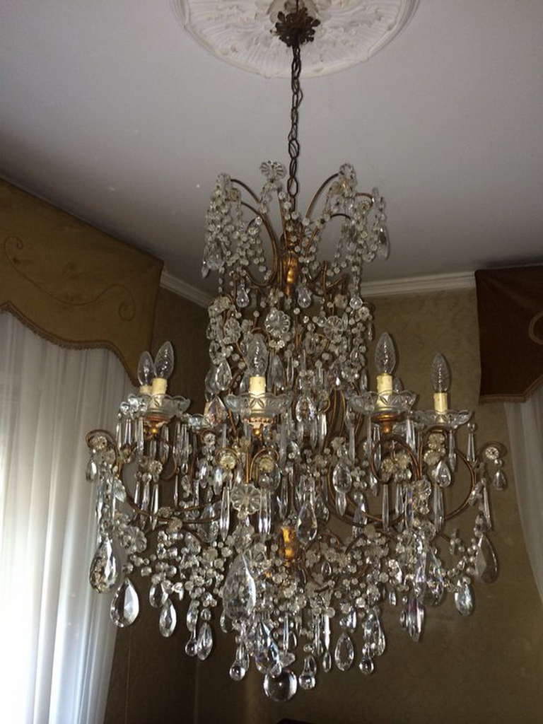 extraordinary louis XV style 8-lights crystal chandelier matching to the wall sconces posted on my storefront.