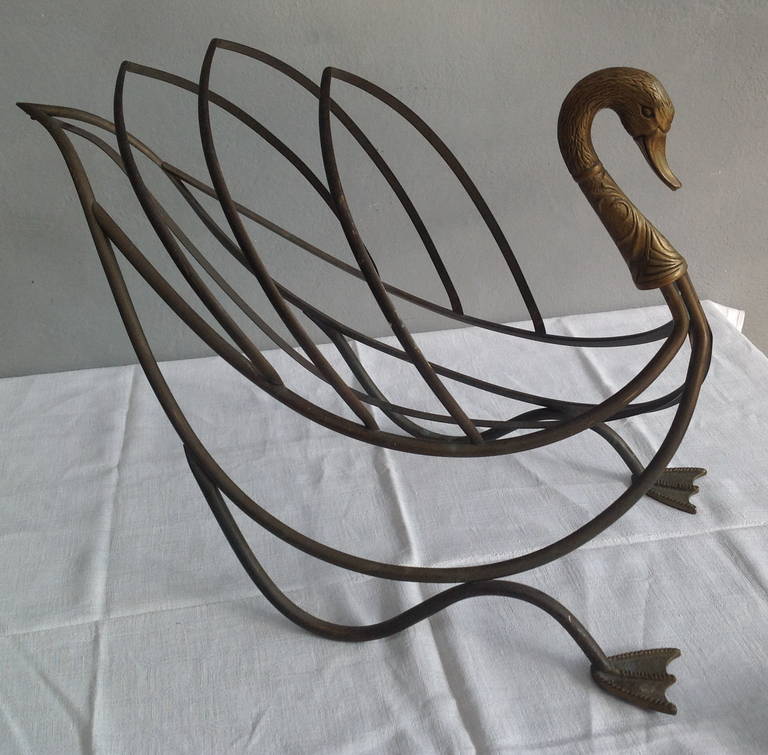 brass magazine rack in swan shape