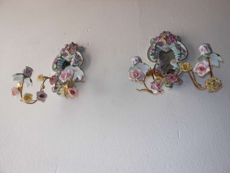 Gold gilt tole with porcelain roses.  3 roses have a chipped petal and flea bites on others.  Mirrors are dark.  Bulb holders are in porcelain as well.  Colors still vibrant.   Re-wired and ready to hang!  Free priority shipping from Italy.